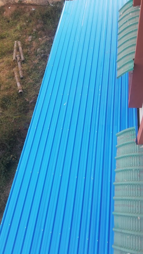 An industrial MS roofing shed covering an outdoor workshop area.